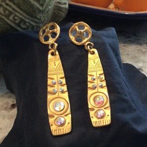 Egyptian anyone? Flat goldtone with crystals set into a patterned 3” drop.